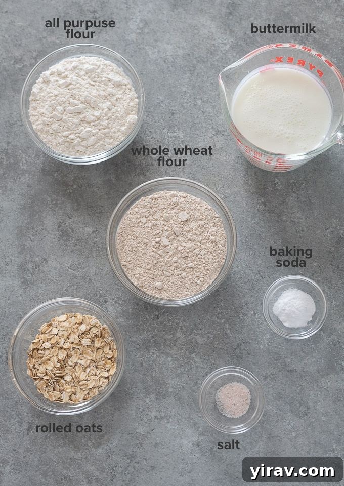 A selection of ingredients for Irish brown bread, including flour, oats, and buttermilk