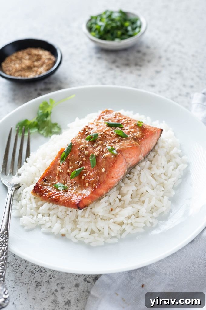 Miso salmon over rice on a plate