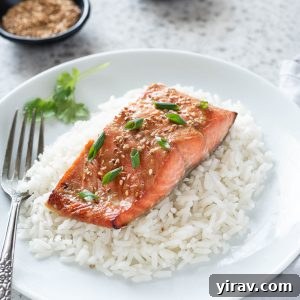Miso salmon over rice on a plate