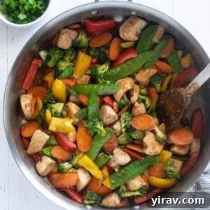 Chicken vegetable stir fry in a skillet