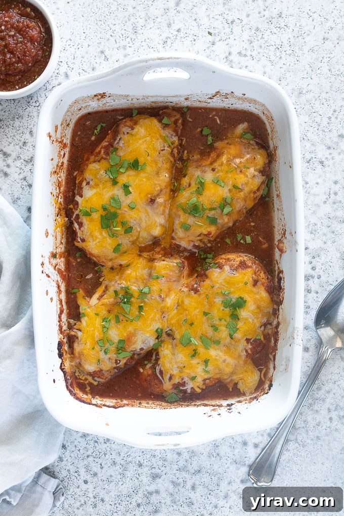 Zesty Baked Salsa Chicken 3 Baked salsa chicken in a white baking dish ready to serve