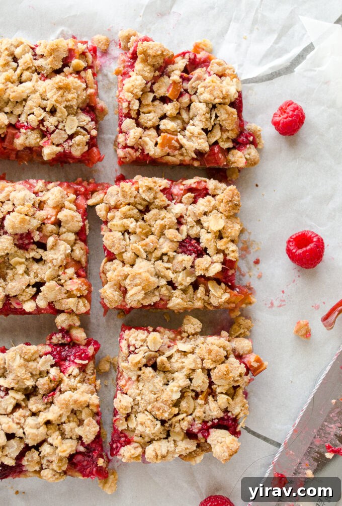 Sweet-Tart Raspberry Rhubarb Bars 3 Raspberry rhubarb crisp bars neatly cut into perfect squares.