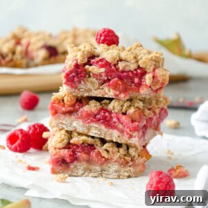 Stack of raspberry rhubarb oatmeal bars.