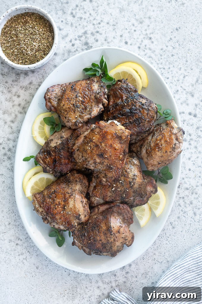 Platter of grilled chicken thighs with lemon, oregano and za'atar seasoning