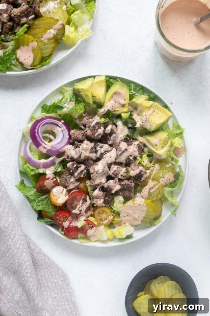 Bunless Burger Delights 2 Freshly prepared low carb burger bowls drizzled with a delicious secret sauce, ready to be enjoyed.