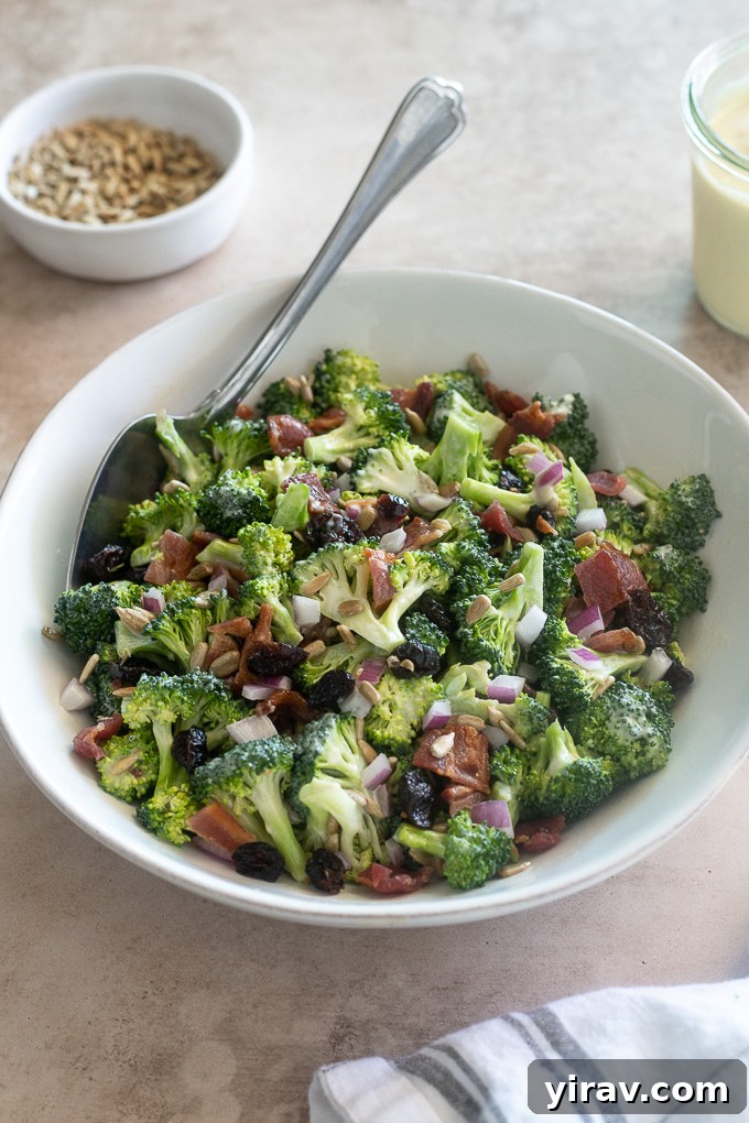 Easy broccoli salad in a bowl with a serving spoon