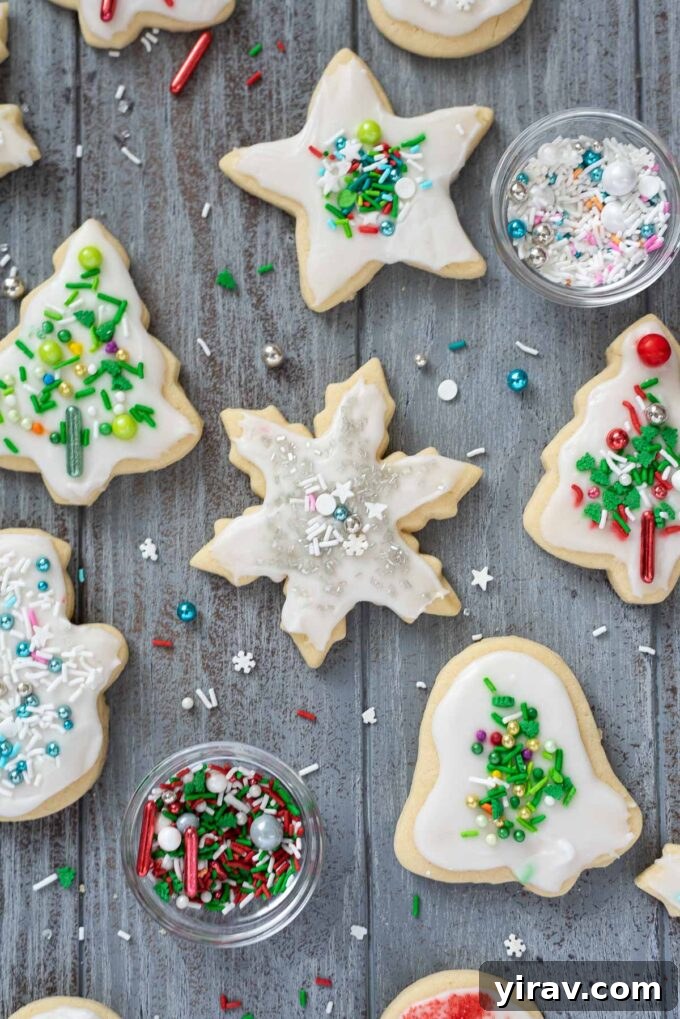 Soft cut out Christmas cookies with shiny festive sprinkles on top.
