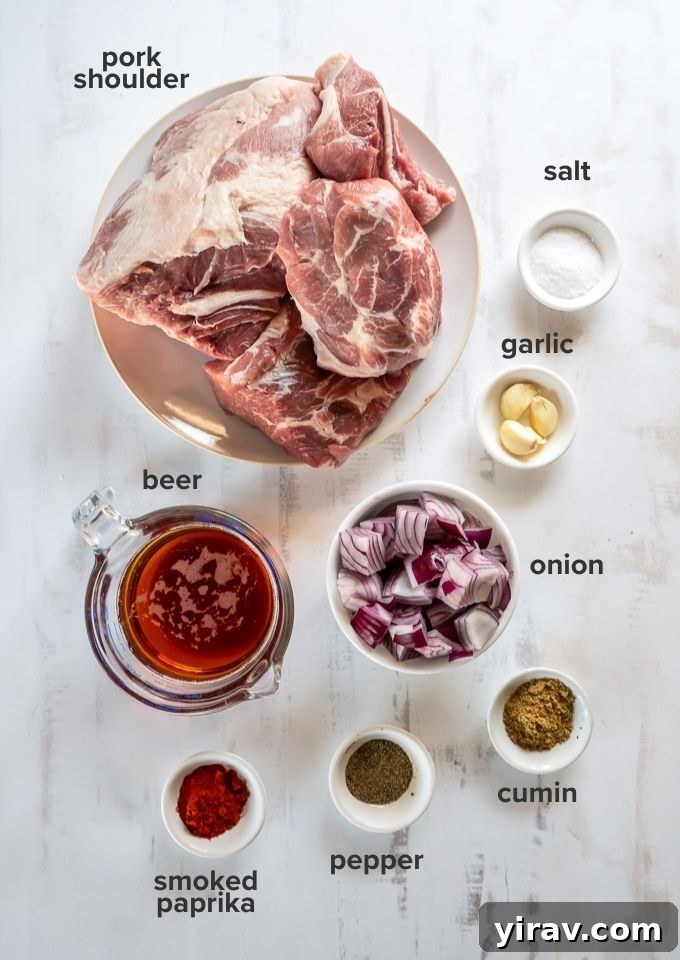 Raw pork shoulder, spices, onion, garlic, and beer as ingredients for slow cooker pulled pork