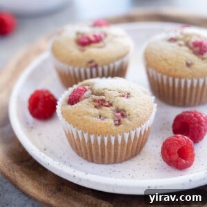Healthy raspberry muffins on a white plate
