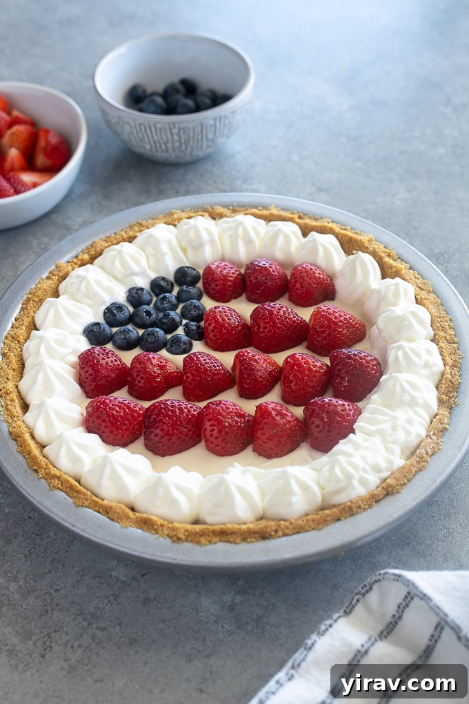 Berry no bake cheesecake decorated like the American flag, perfect for patriotic holidays