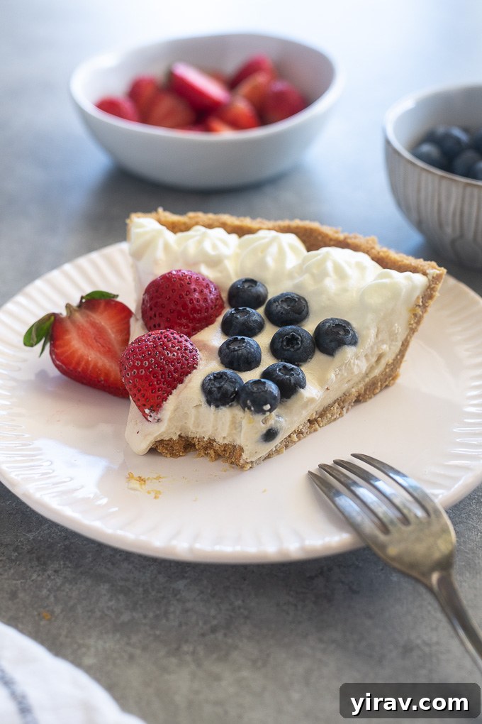 Berry no bake cheesecake on a plate, perfect for 4th of July