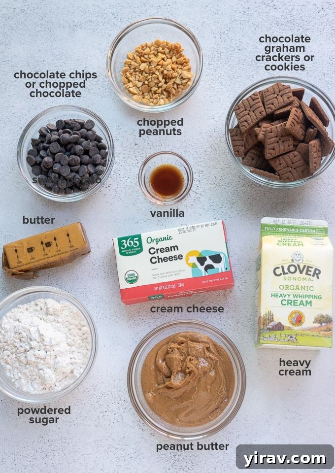 Various ingredients for Chocolate Peanut Butter Pie, including cream cheese, peanut butter, powdered sugar, heavy cream, chocolate graham crackers, and butter, laid out on a wooden surface.