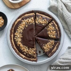 Chocolate peanut butter pie sliced with one piece missing