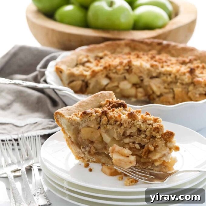 Slice of Dutch apple pie with streusel topping