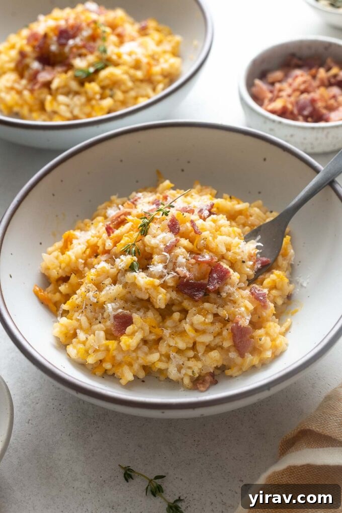 Creamy Pumpkin Risotto in a bowl with a fork