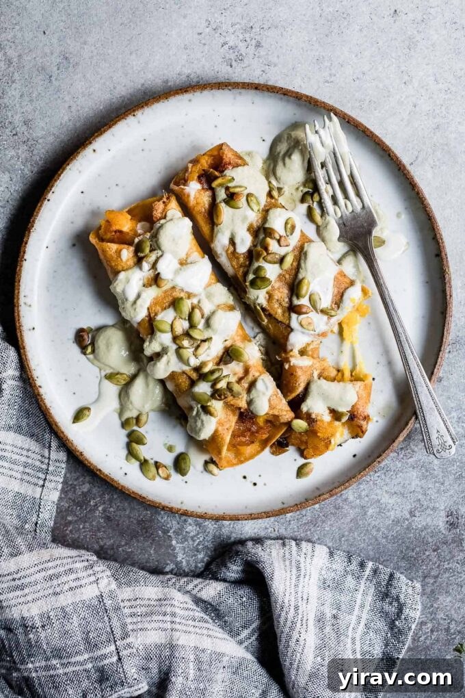 Cheesy Pumpkin Taquitos with Roasted Jalapeño Pepita Crema