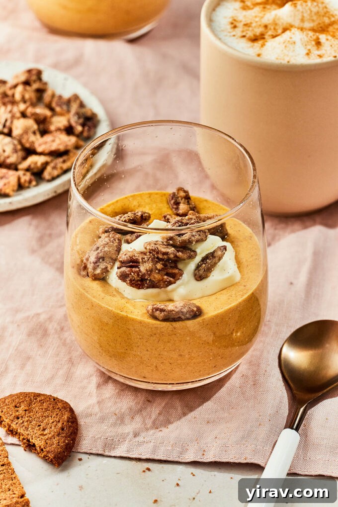 Light and fluffy Pumpkin Mousse without gelatine in a jar with whipped cream and pecans