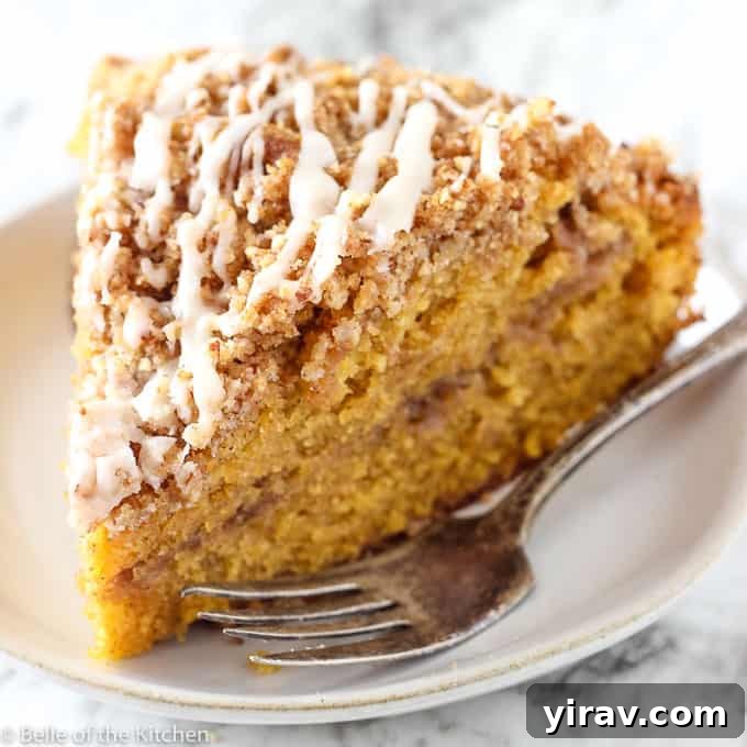 Slice of moist Pumpkin Spice Coffee Cake on a plate