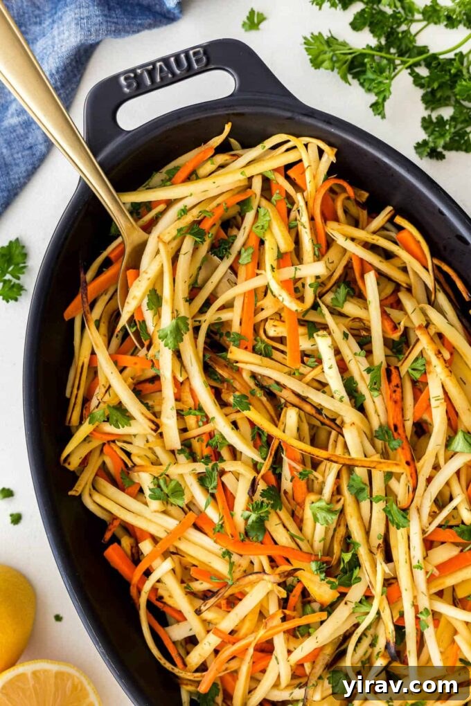 Pan-fried carrots and parsnips garnished with fresh dill and lemon