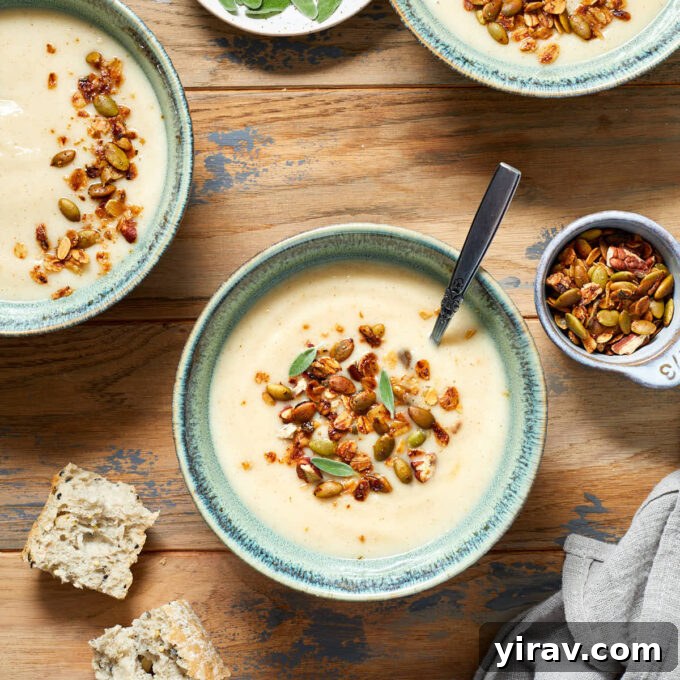Cozy bowl of parsnip and pear soup topped with crispy edamame