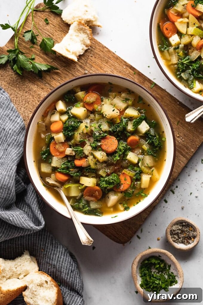 Hearty bowl of root vegetable soup filled with chunky vegetables