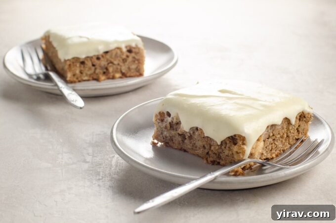 Slice of parsnip cake with cream cheese frosting and spice