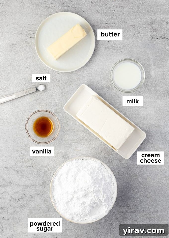 Dreamy Cream Cheese Frosting 4 Display of cream cheese frosting recipe ingredients: cream cheese, butter, powdered sugar, milk, vanilla extract, and salt.