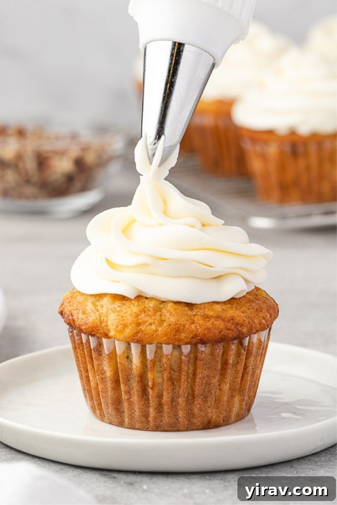 Dreamy Cream Cheese Frosting 6 Cream cheese frosting expertly piped onto a cupcake, ready for serving.