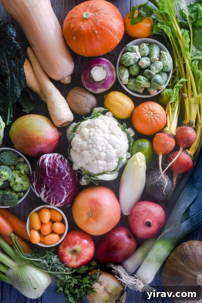 Winter fruits and vegetables laid out including citrus, squash, and greens