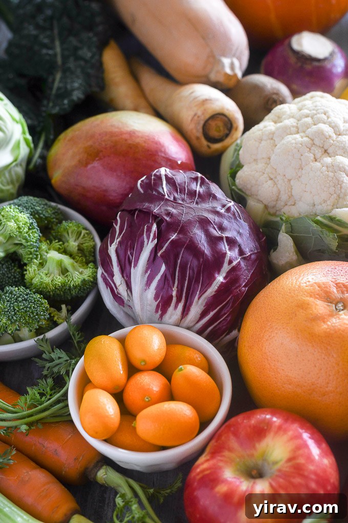 Winter produce including kumquats, radicchio, orange, apple, and fennel