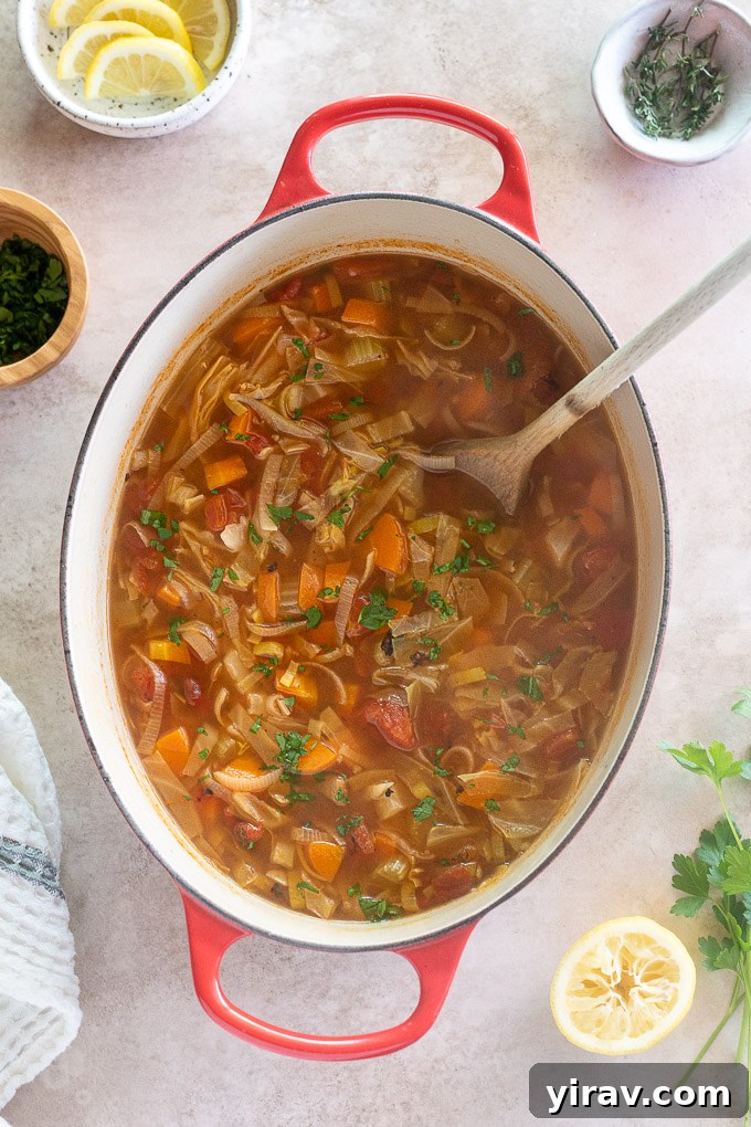 Dutch oven with old fashioned cabbage soup, showcasing a rustic and inviting meal.