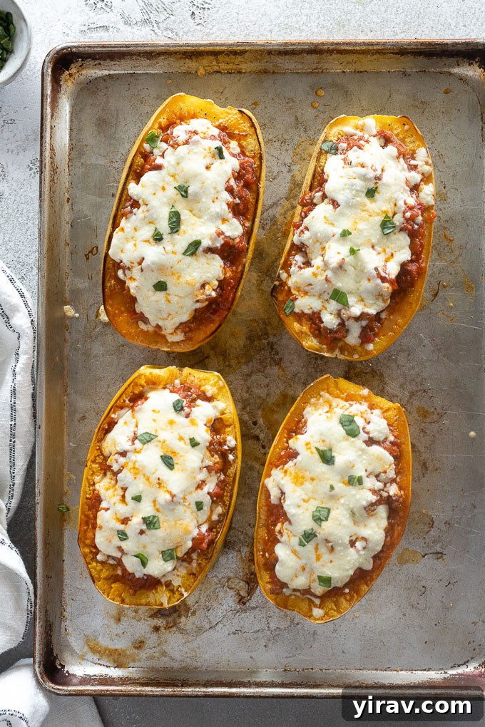 Noodle-Free Lasagna Bake 8 Spaghetti squash lasagna boats on a baking sheet