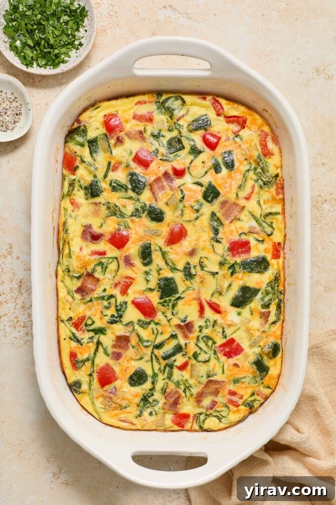 Effortless Bacon and Egg Bake 2 Delicious Bacon and Egg Casserole in a baking dish, ready to be served for breakfast or brunch.