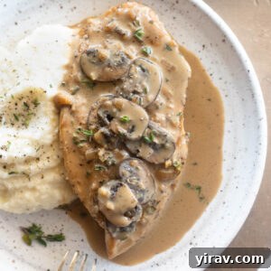 Creamy chicken marsala on a plate with mashed potatoes