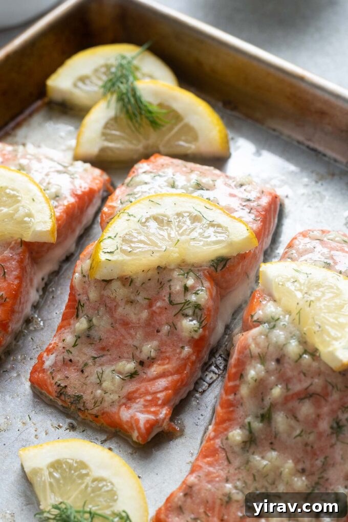 Irresistible Garlic Butter Salmon 6 Perfectly baked salmon with lemon and garlic butter, ready to be served from the sheet pan.