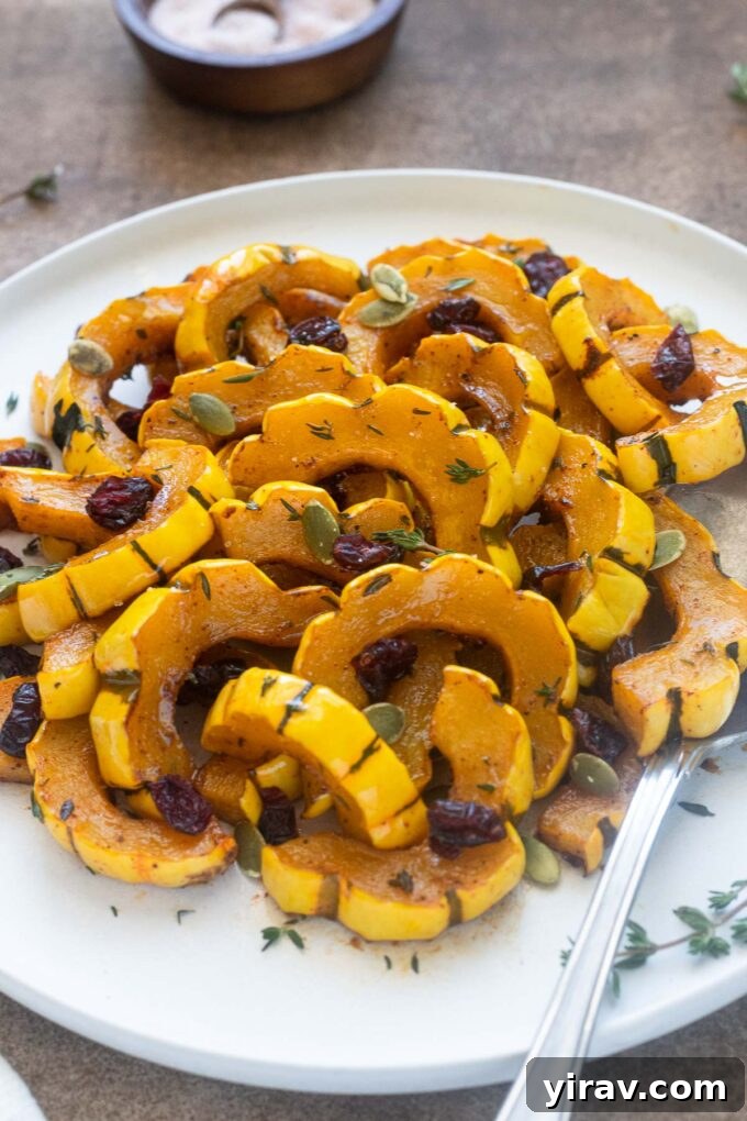 Maple-Kissed Delicata Delight 7 Maple roasted delicata squash with dried cranberries and pepitas.