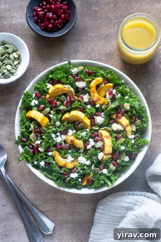 Delicata squash salad in a bowl with dressing alongside, capturing the vibrant colors of autumn.