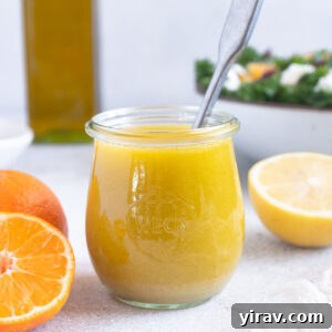 Zesty Citrus Vinaigrette 8 Citrus vinaigrette in a jar with spoon inside, ready to be served.