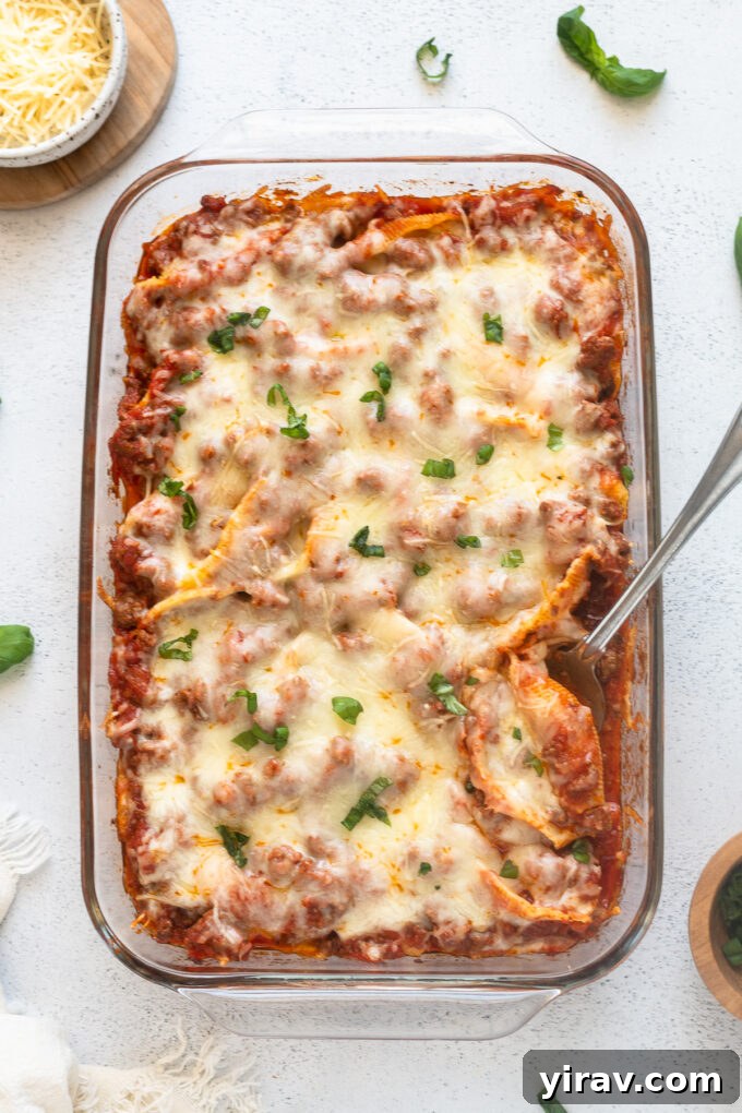 Stuffed shells with a rich beef and ricotta filling, perfectly arranged in a baking dish.