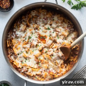 Cabbage and ground beef casserole in a skillet with cheese.