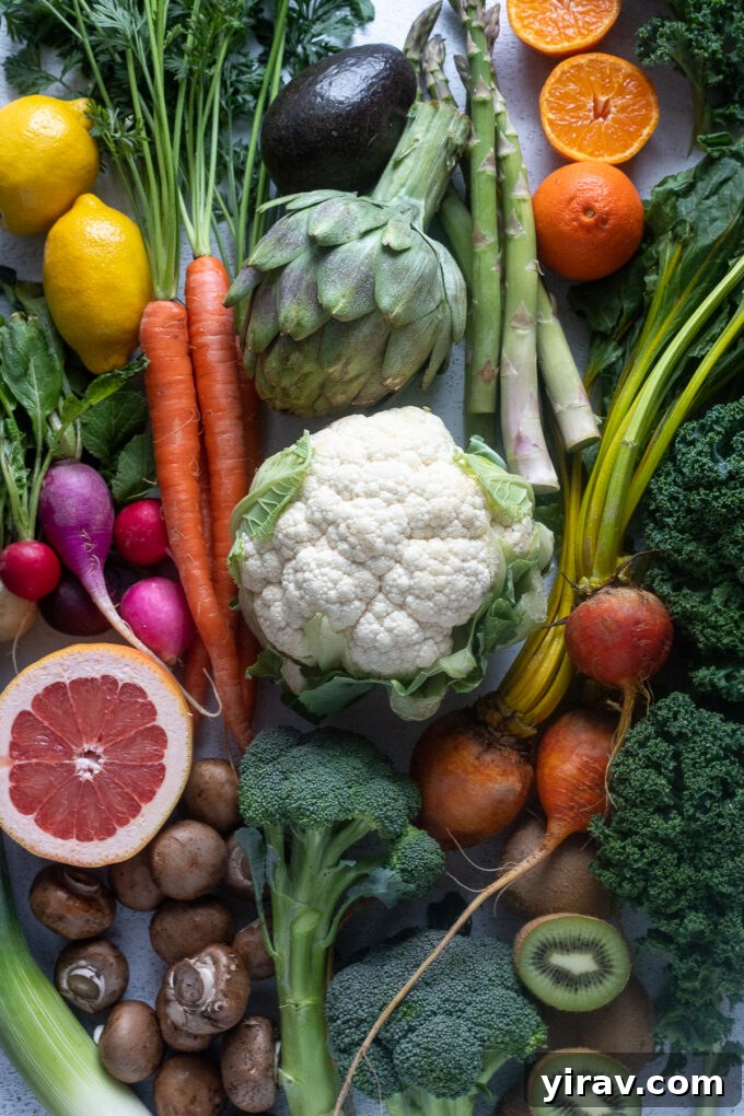 A colorful array of fresh March seasonal fruits and vegetables, showcasing the transition from winter's bounty to early spring's first offerings.