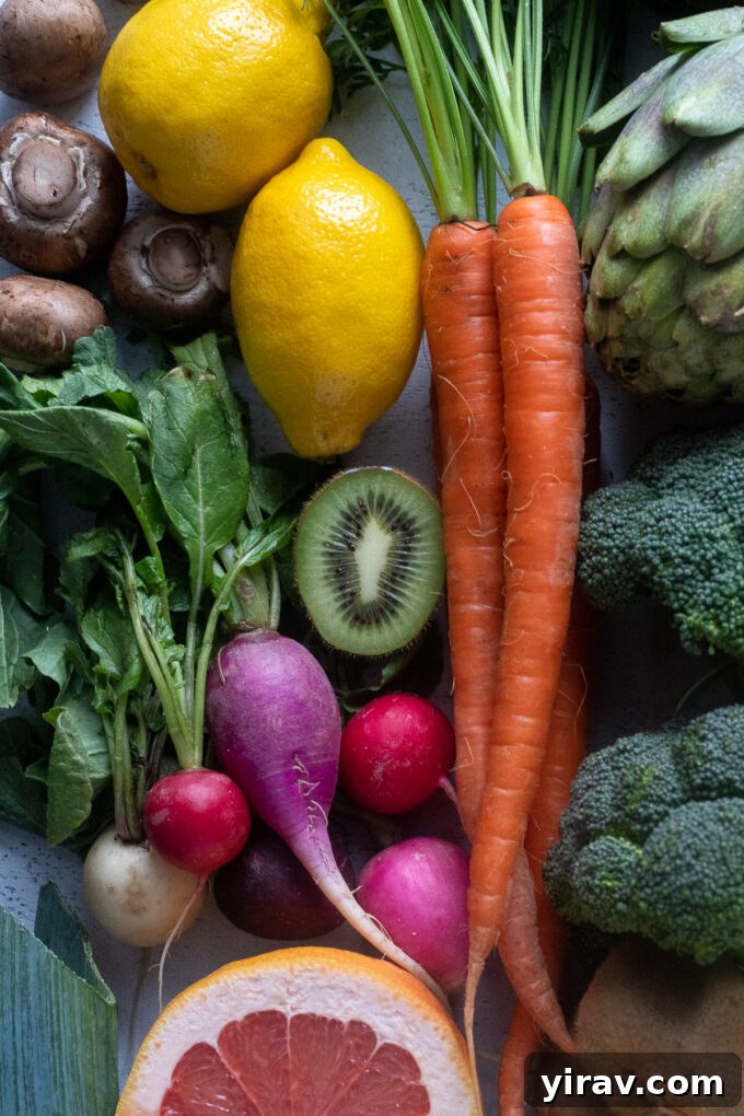 March seasonal produce arranged artfully, featuring a mix of late winter and early spring fruits and vegetables.