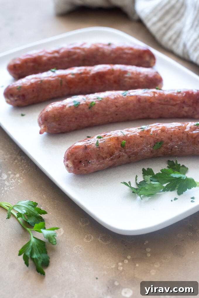 Air fried Italian sausage on a plate with parsley.