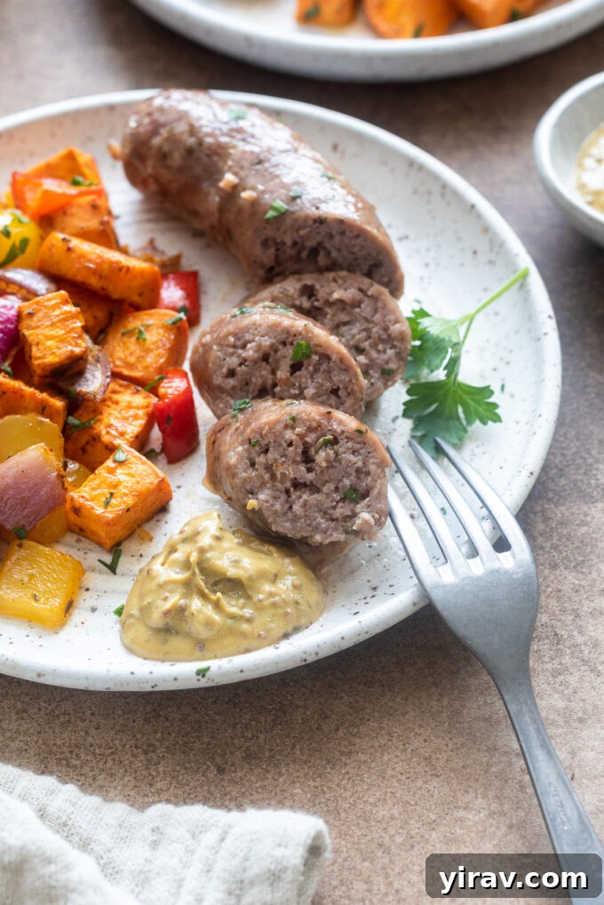 One pan sausage and veggies on a plate with grainy mustard.