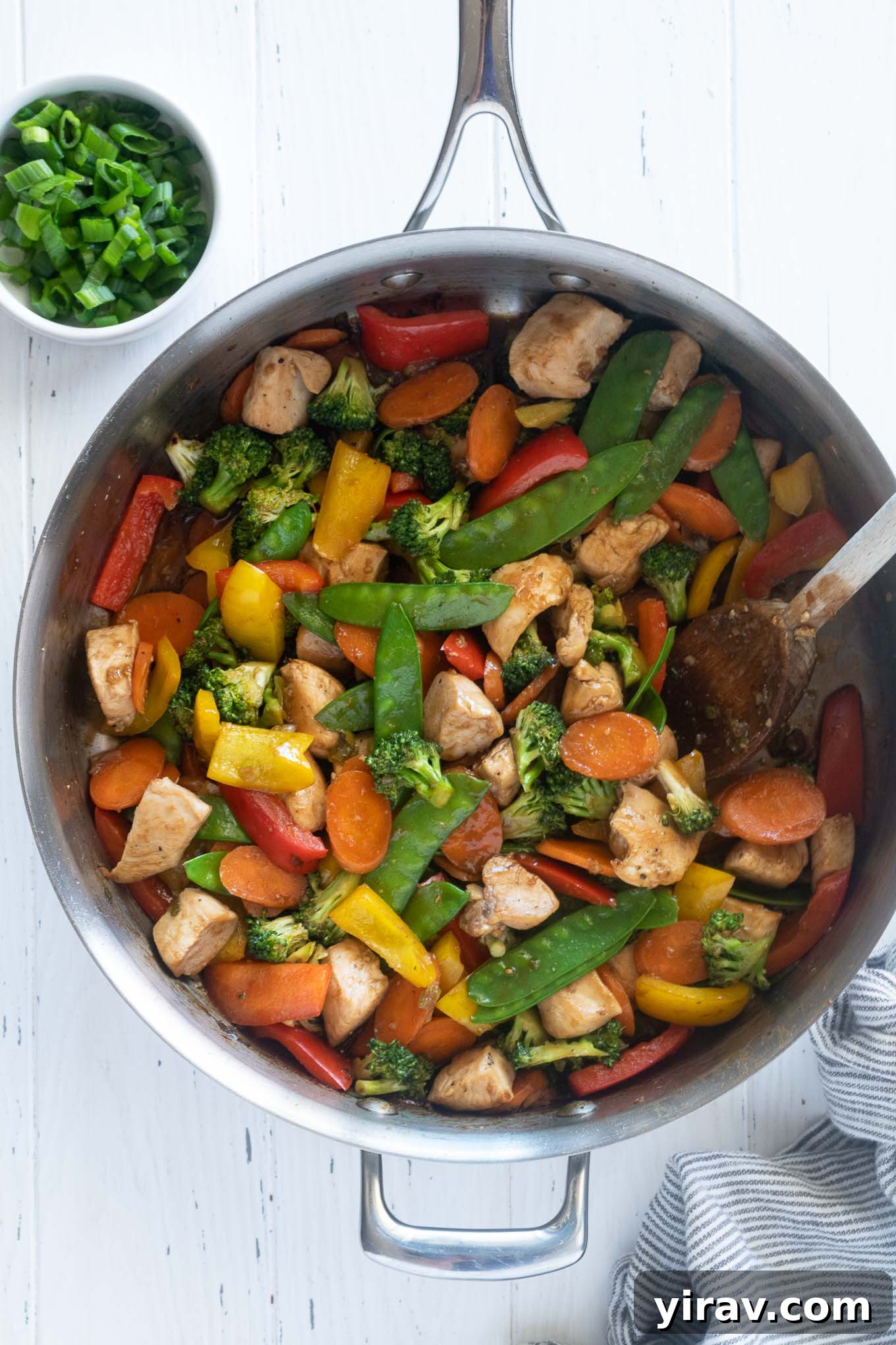 Chicken vegetable stir fry in a skillet