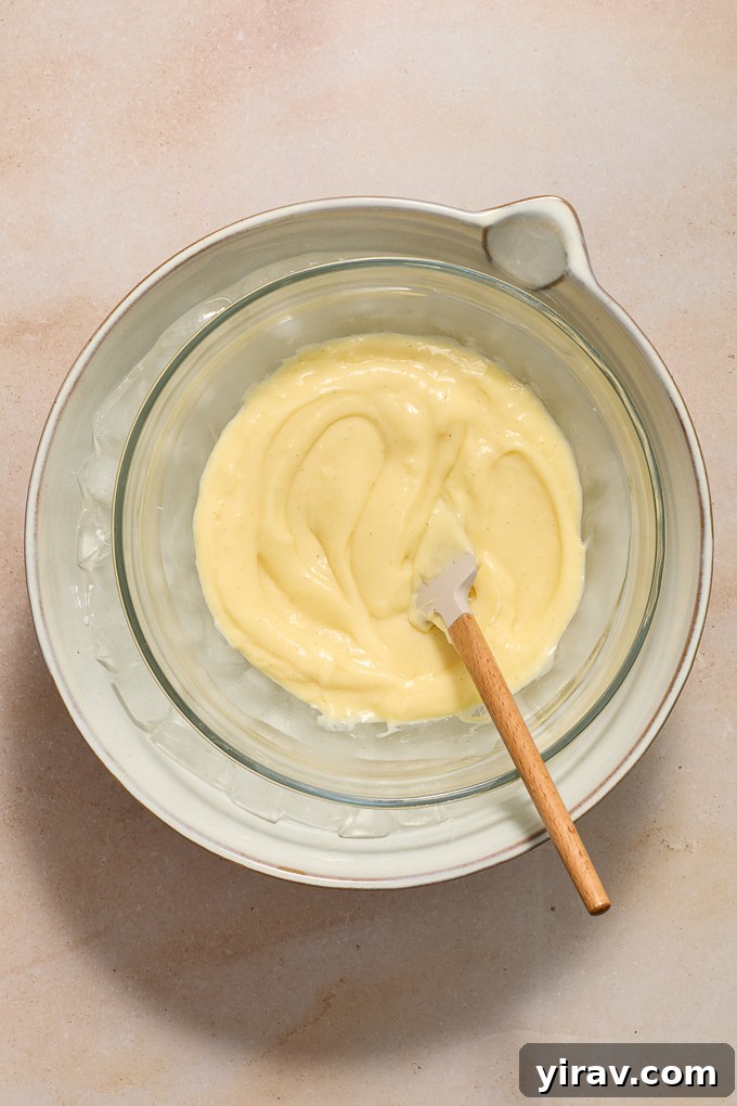 Strained pastry cream in ice bath.