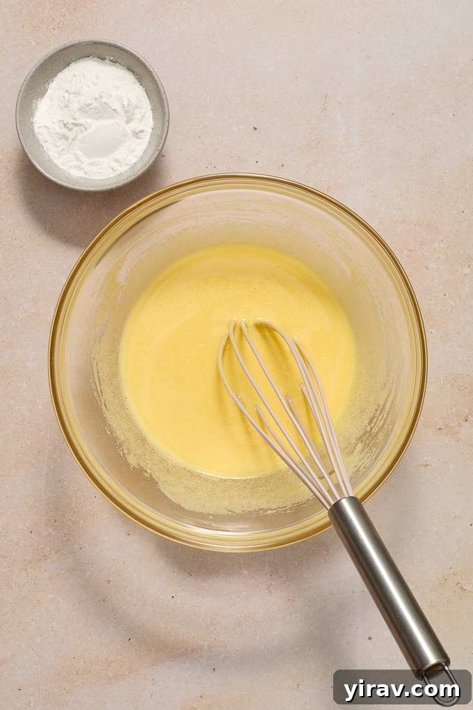 Whisked egg yolks and sugar for pastry cream.