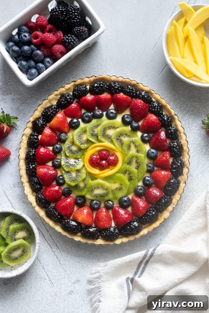 Classic French fruit tart glazed with apricot jelly, showcasing vibrant fresh fruits