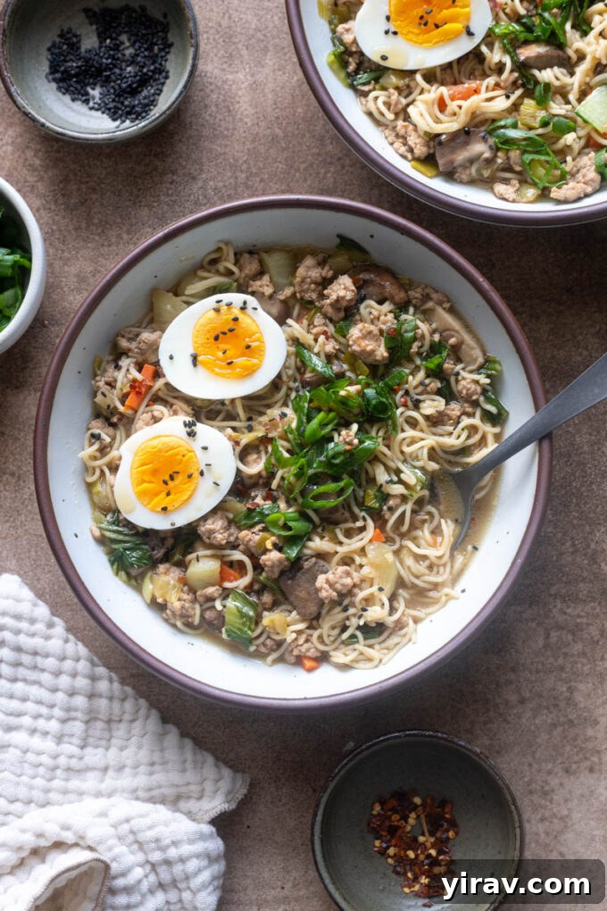 A hearty bowl of Ground Pork Ramen, featuring bok choy, shiitake mushrooms, and topped with perfectly soft-boiled eggs.