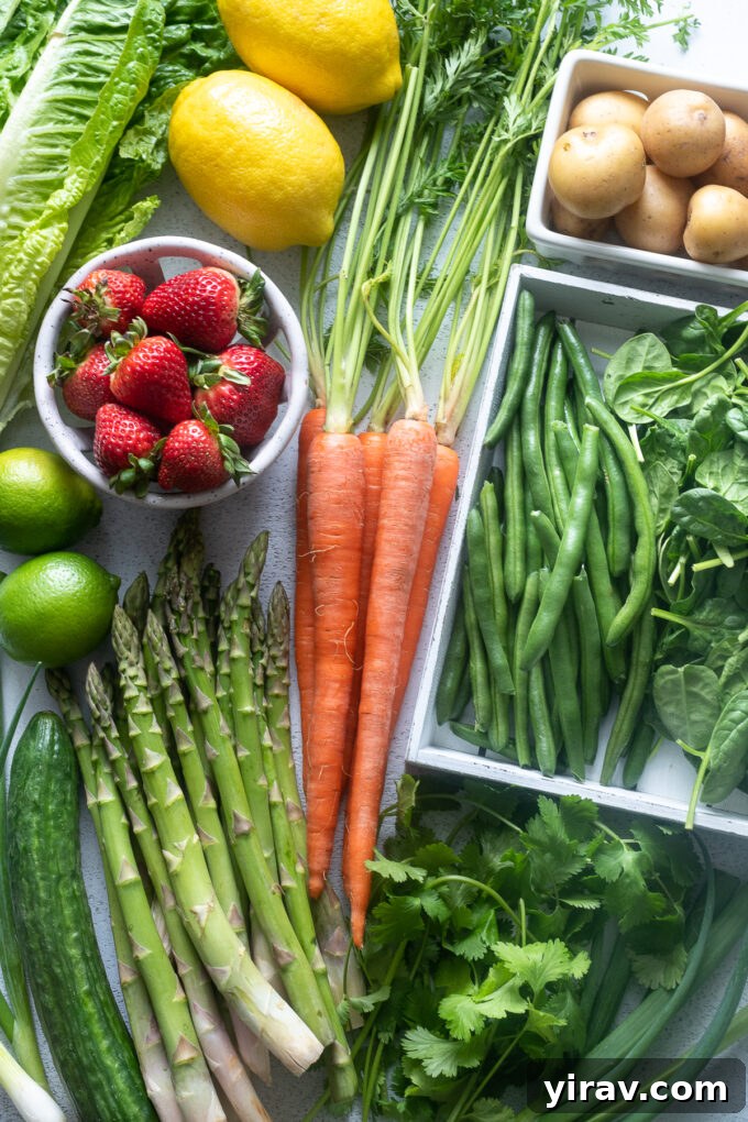 A colorful array of fruits and vegetables in season in May, showcasing the freshness and variety of spring's harvest.